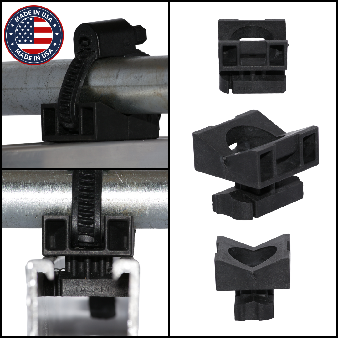 Black plastic clamp or holder on metal pipes with 'Made in USA' badge.
